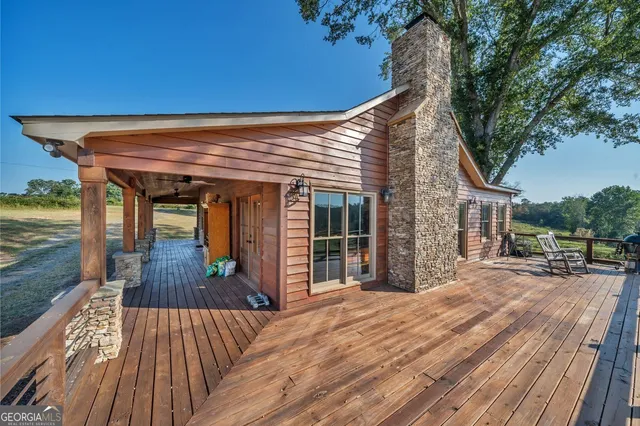 a porch with seating space and yard