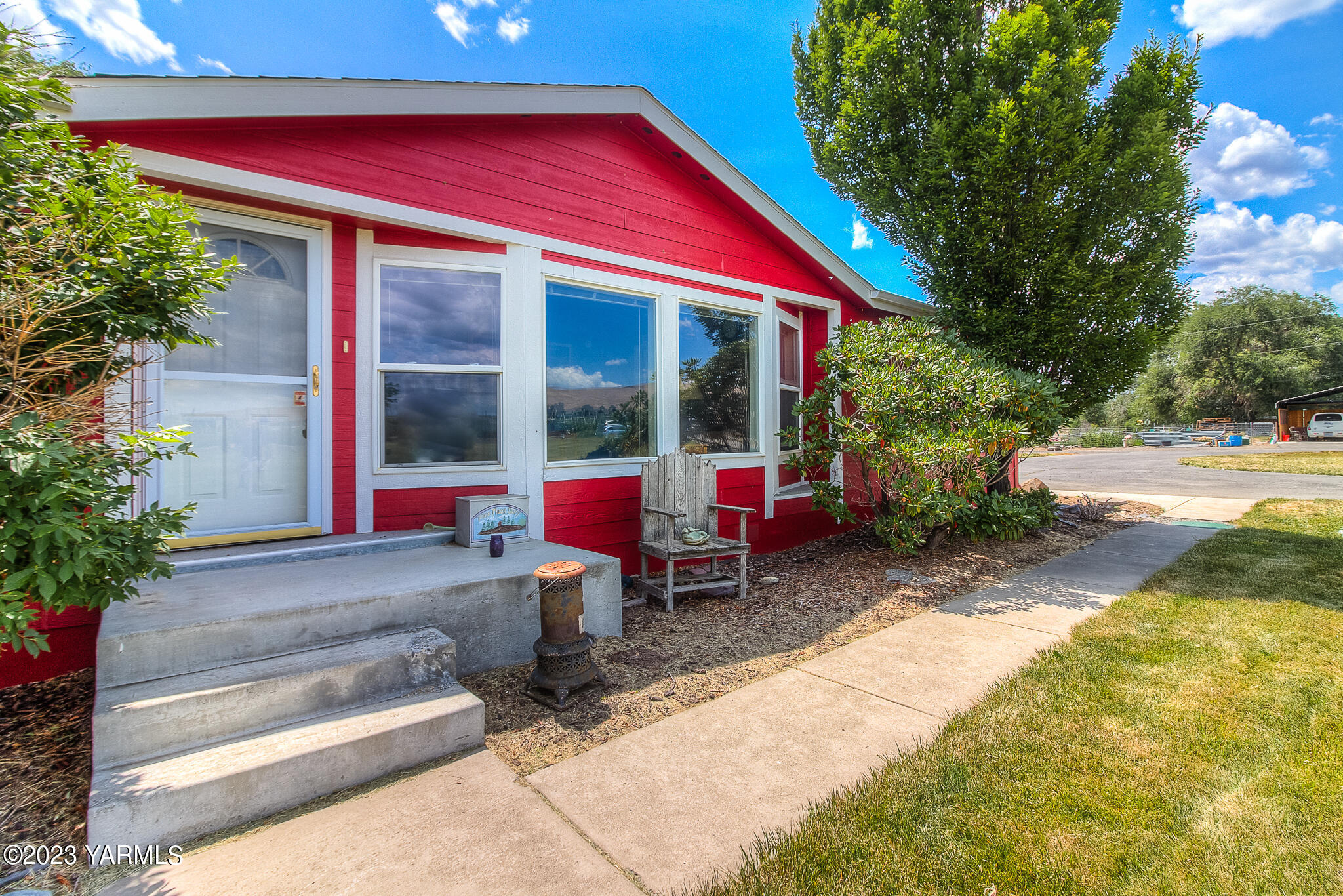 13100 West Barrett Road Yakima, WA 98908 - Photo 4 of 43 a view of a house with a yard patio and sitting area