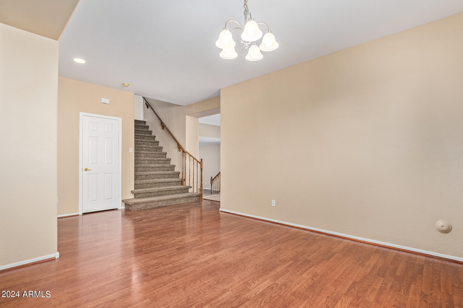 504 North Swallow Lane Gilbert, AZ 85234 - Photo 11 of 54 a view of a room with wooden floor and staircase