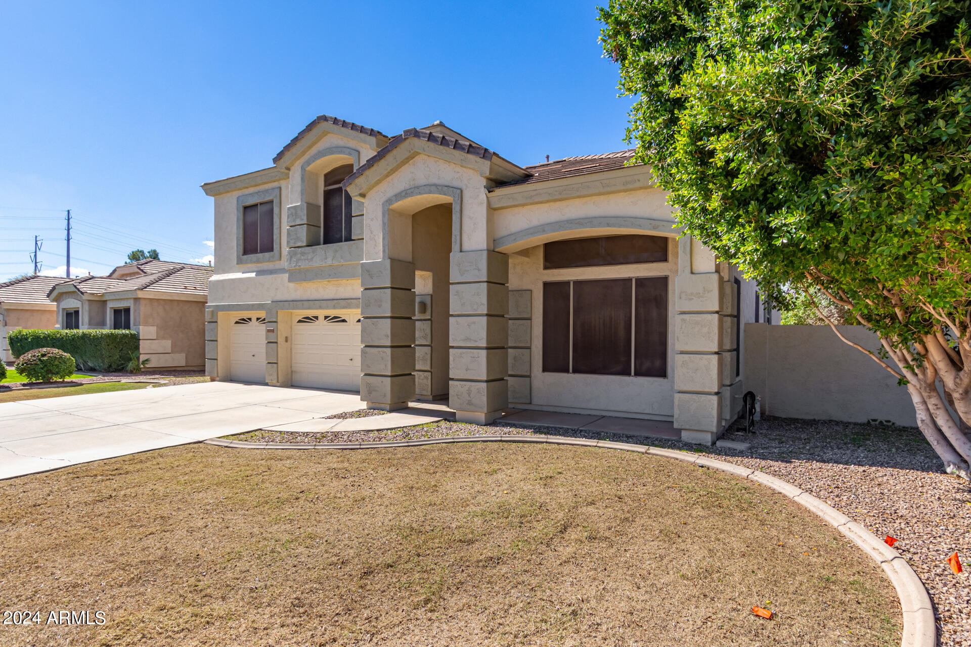 504 North Swallow Lane Gilbert, AZ 85234 - Photo 2 of 54 a front view of a house with a yard