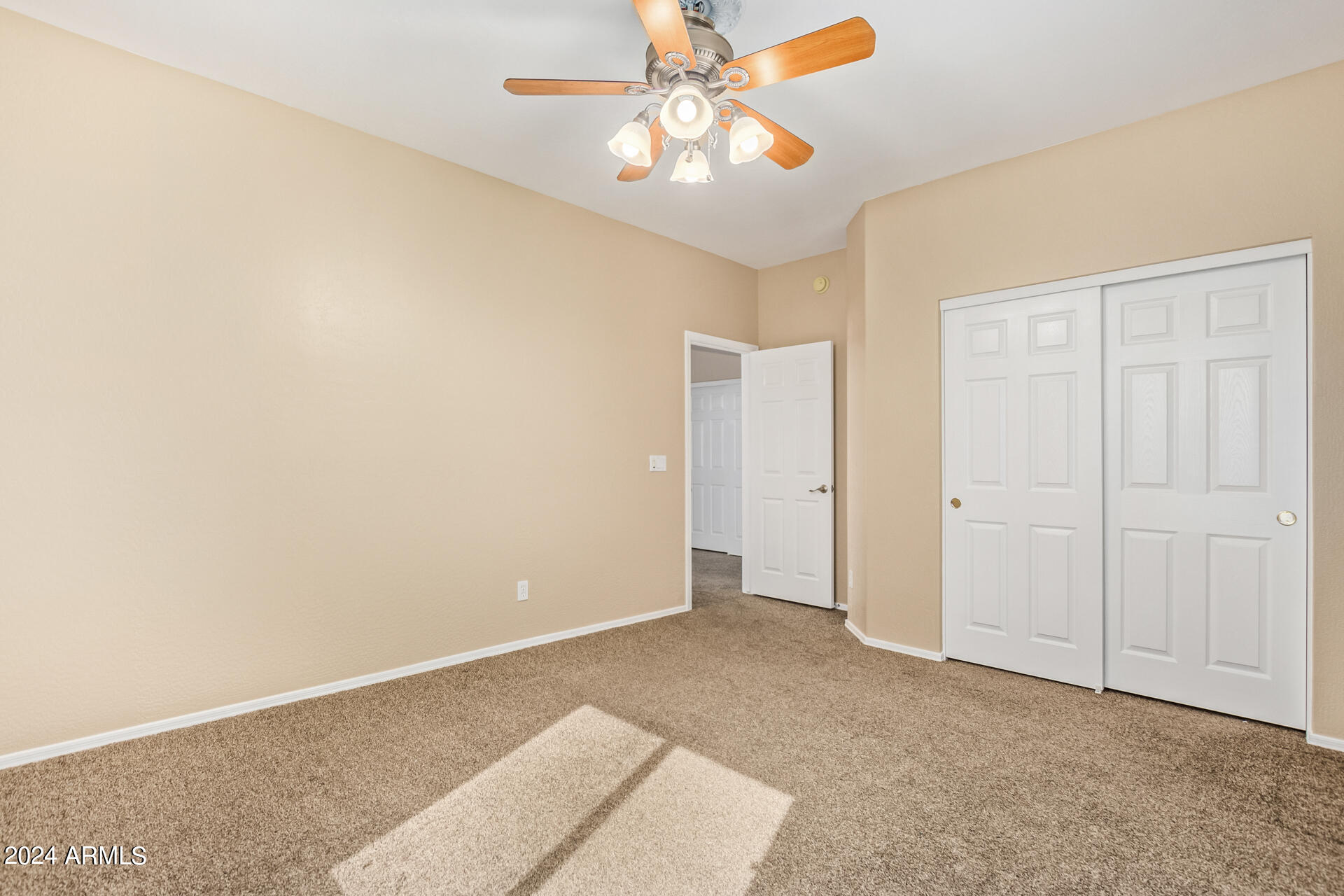 504 North Swallow Lane Gilbert, AZ 85234 - Photo 21 of 54 a view of an empty room with chandelier fan
