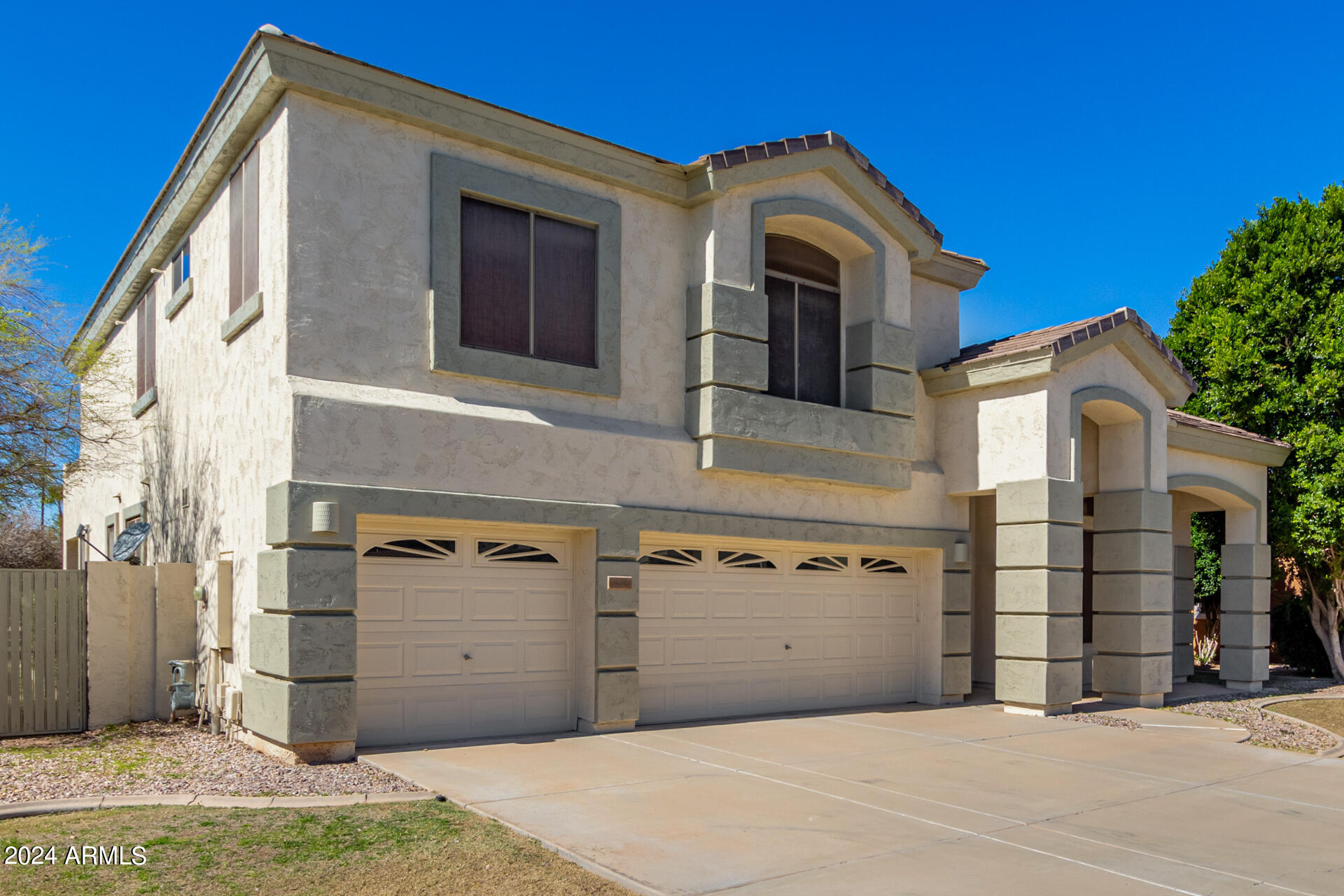 504 North Swallow Lane Gilbert, AZ 85234 - Photo 3 of 54 a view of a house with a garage