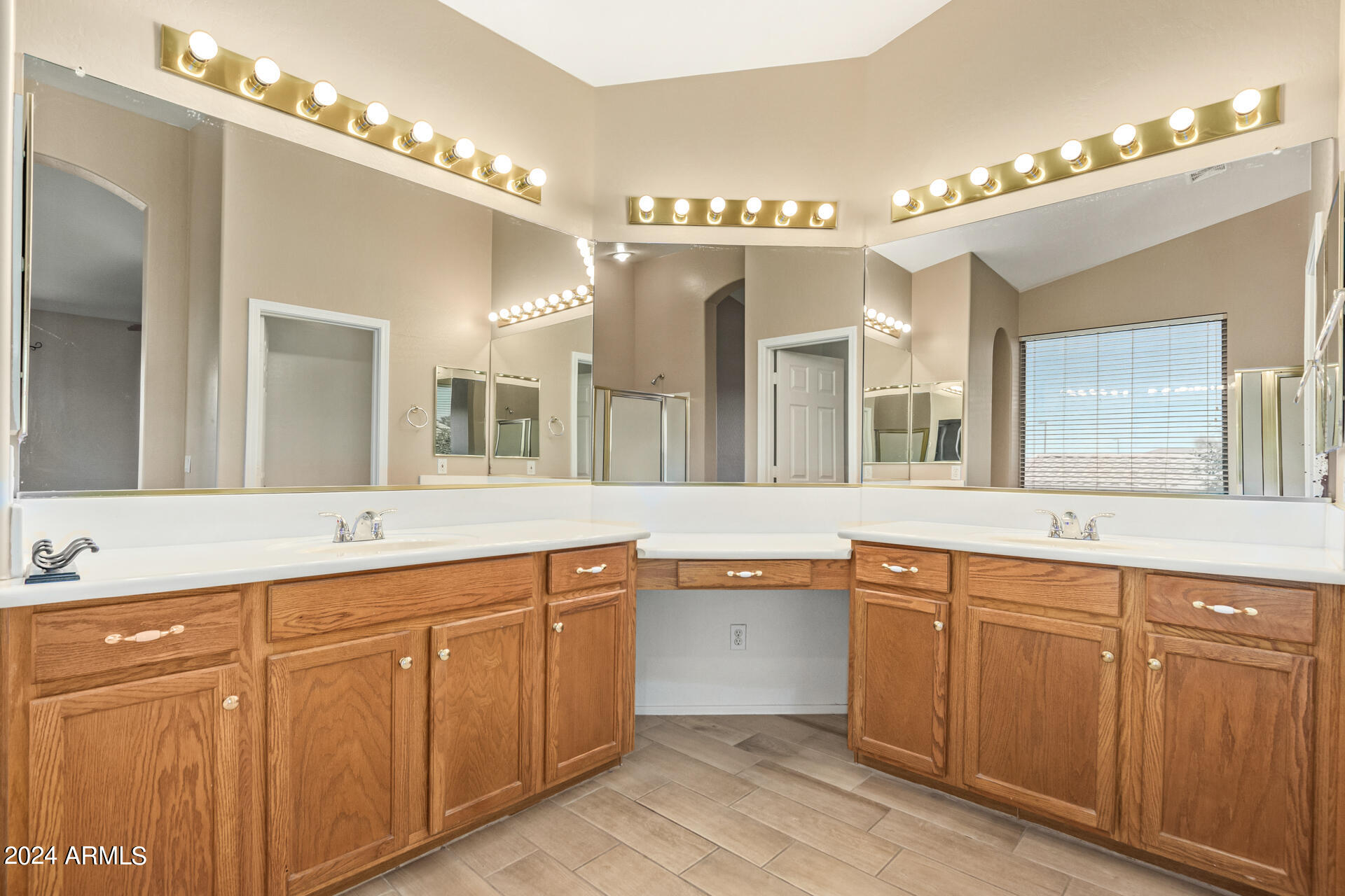 504 North Swallow Lane Gilbert, AZ 85234 - Photo 35 of 54 a spacious bathroom with a sink double vanity and a mirror