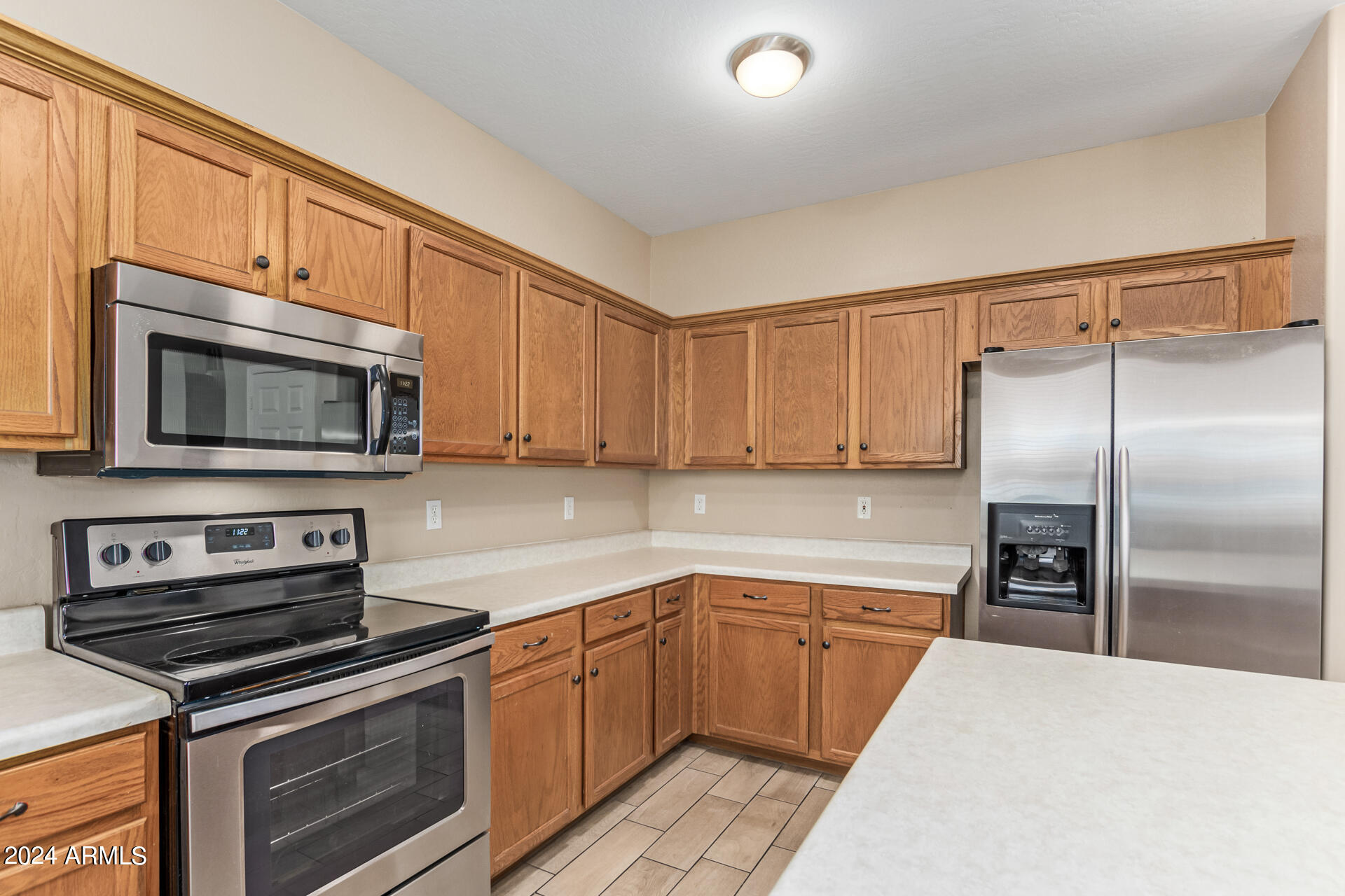 504 North Swallow Lane Gilbert, AZ 85234 - Photo 39 of 54 a kitchen with a sink stove and microwave