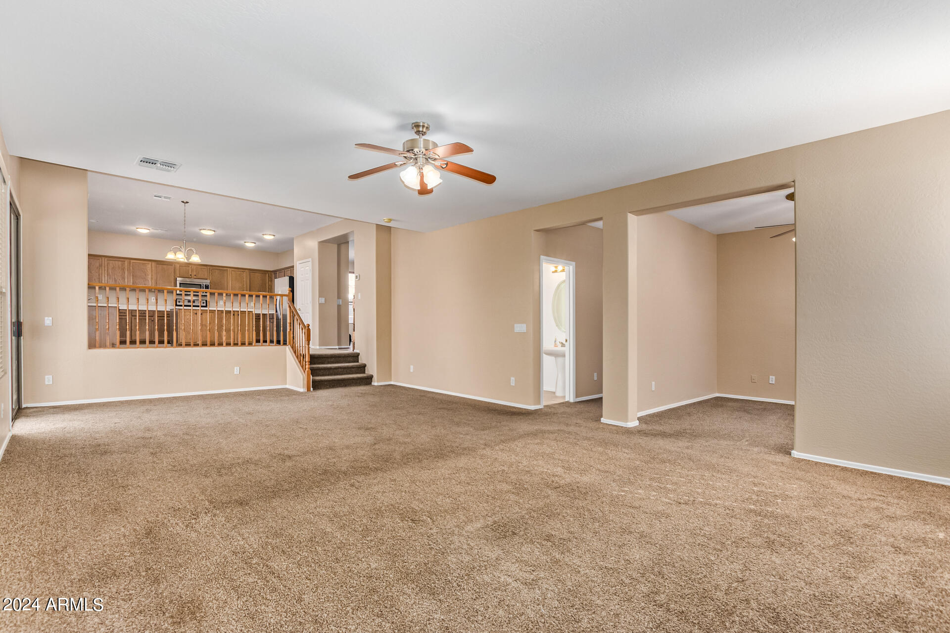 504 North Swallow Lane Gilbert, AZ 85234 - Photo 47 of 54 a view of an empty room with a ceiling fan
