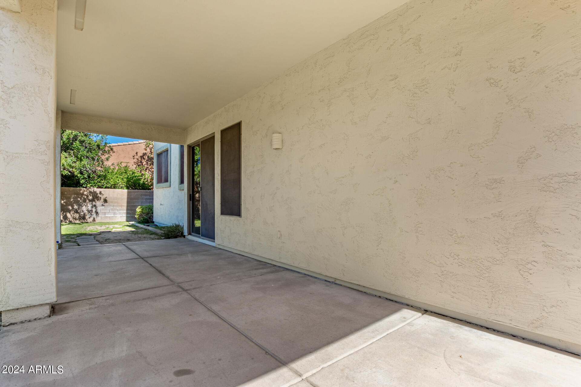 504 North Swallow Lane Gilbert, AZ 85234 - Photo 54 of 54 a view of backyard with hardwood and front door
