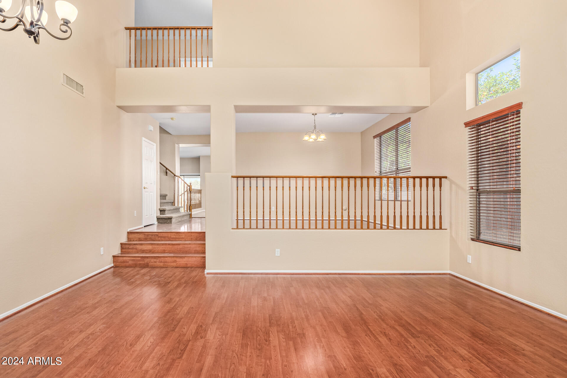 504 North Swallow Lane Gilbert, AZ 85234 - Photo 8 of 54 a view of a room with wooden floor and stairs