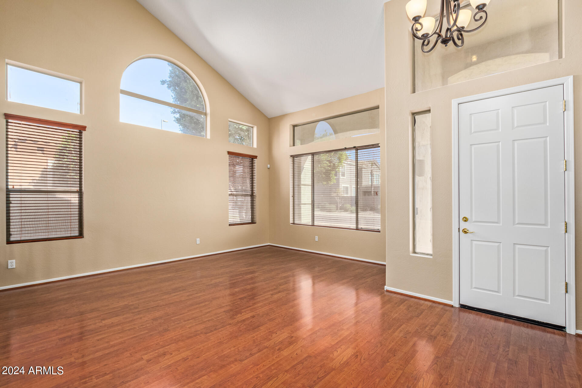 504 North Swallow Lane Gilbert, AZ 85234 - Photo 10 of 54 an empty room with wooden floor and windows