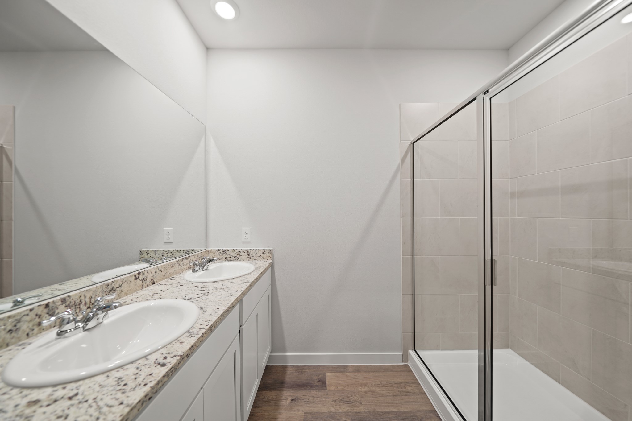 17143 King Eider Road Waller, TX 77484 - Photo 13 of 29 a bathroom with a granite countertop sink and a mirror