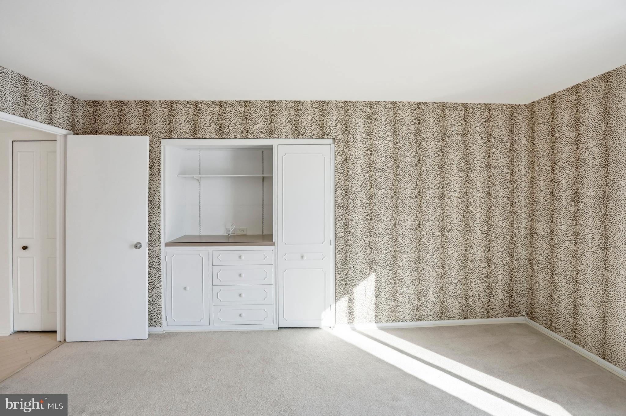 7 Slade Avenue, Unit 414 Baltimore, MD 21208 - Photo 23 of 40 Spacious Bedroom with Built Ins