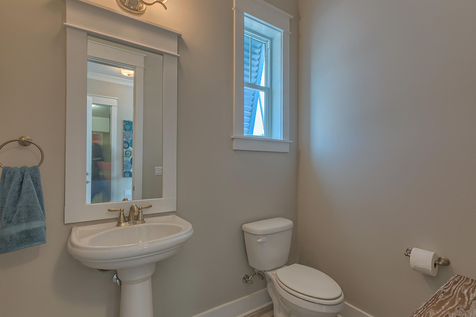53 Pine Lands Loop Inlet Beach East, Unit A Inlet Beach, FL 32461 - Photo 8 of 27 a bathroom with a sink a toilet and mirror