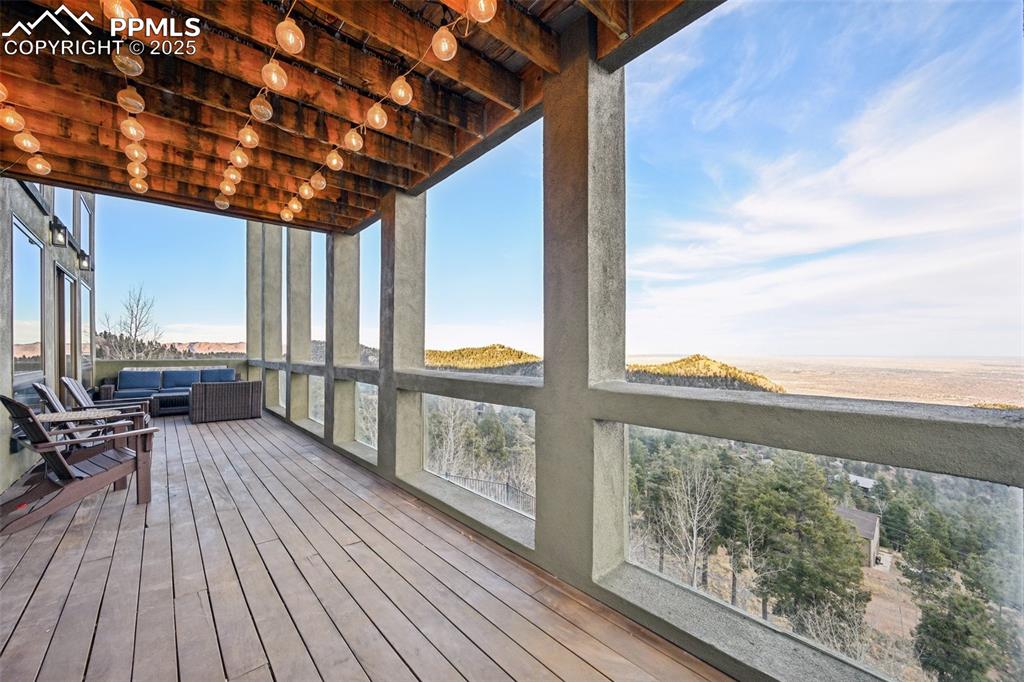 1417 Forest Road Manitou Springs, CO 80829 - Photo 17 of 50 a view of balcony with couch and wooden floor