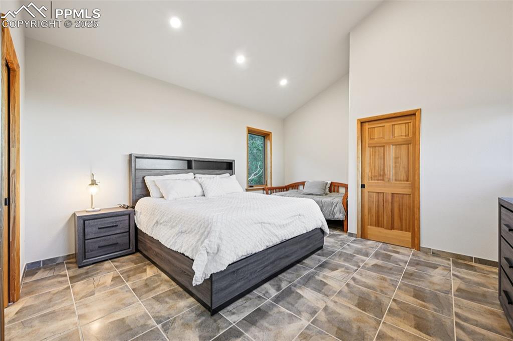 1417 Forest Road Manitou Springs, CO 80829 - Photo 28 of 50 a bedroom with a bed and a cabinets