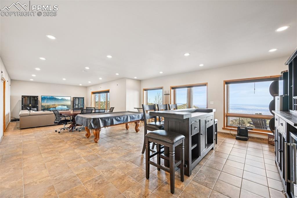 1417 Forest Road Manitou Springs, CO 80829 - Photo 38 of 50 a living room with furniture and a flat screen tv
