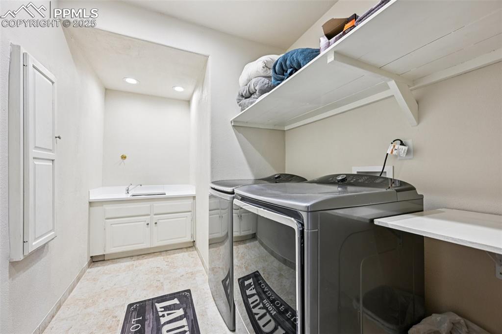 1417 Forest Road Manitou Springs, CO 80829 - Photo 44 of 50 a utility room with sink dryer and washer