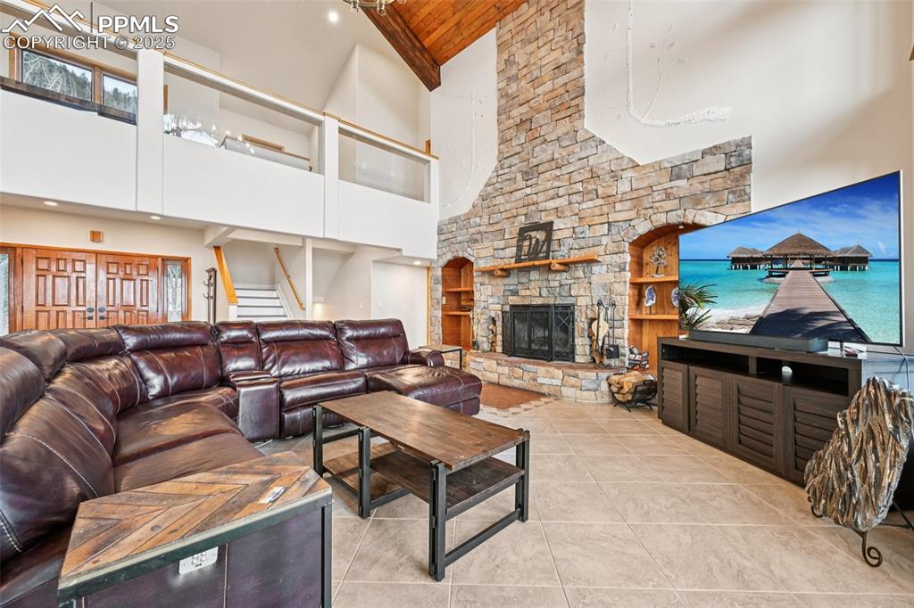 1417 Forest Road Manitou Springs, CO 80829 - Photo 5 of 50 a living room with furniture and a fireplace