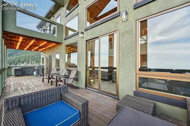 a view of a dinning table and chairs in the patio
