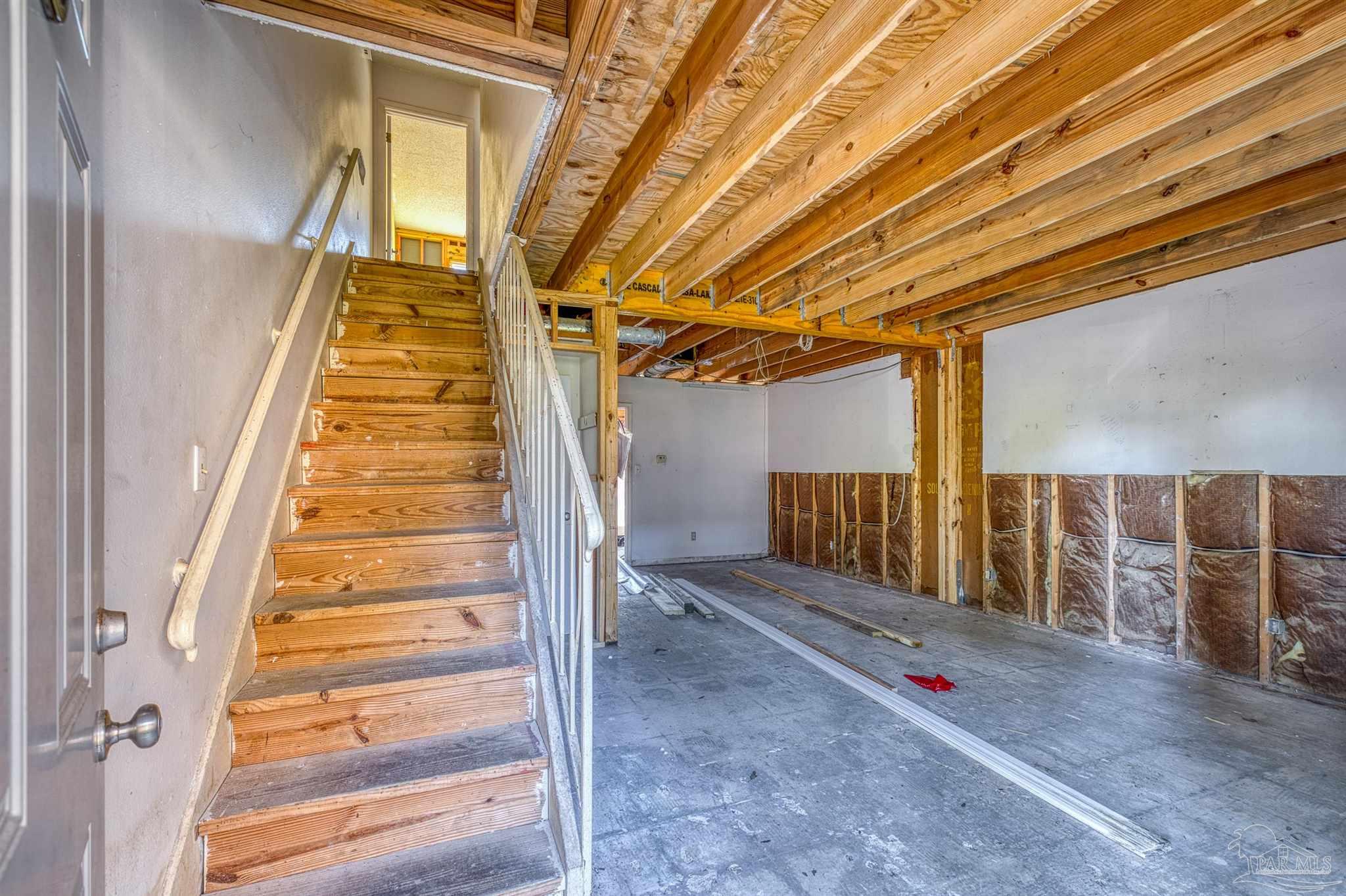 8101 Tippin Avenue, Unit D Pensacola, FL 32514 - Photo 4 of 18 a view of a room with stairs