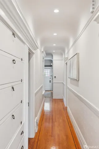 a view of entryway with wooden floor