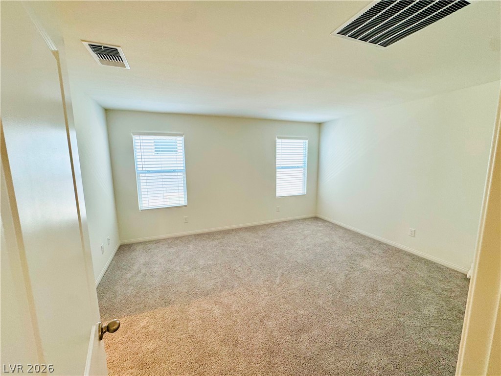 9249 Innot Avenue Las Vegas, NV 89148 - Photo 15 of 24 A well-proportioned room featuring twin windows and plush carpeting for comfort.