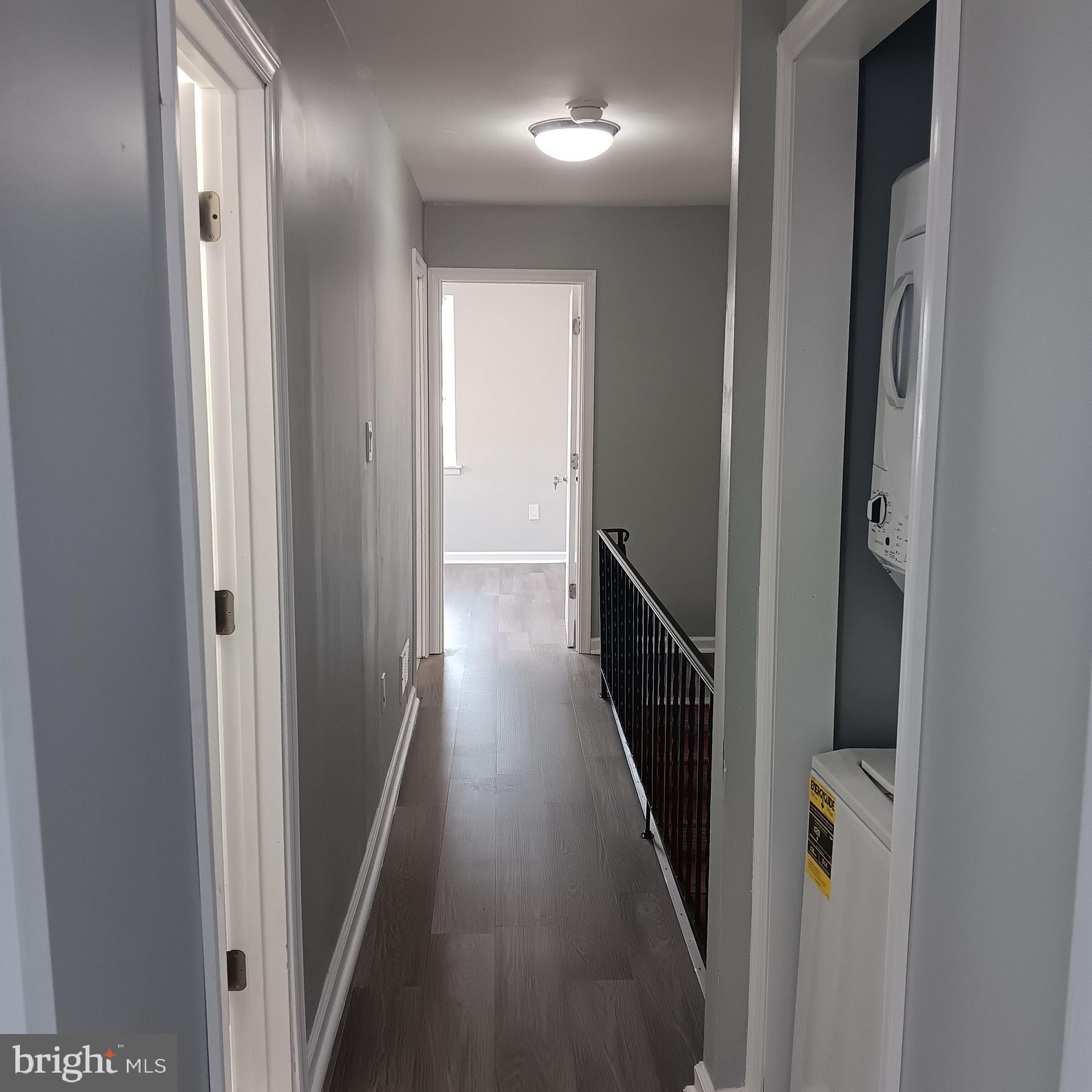 2036 North Gratz Street, Unit 2 Philadelphia, PA 19121 - Photo 5 of 14 a view of a hallway with wooden floor