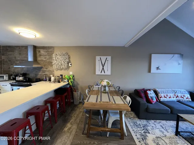 a bedroom with a bed and a night stand