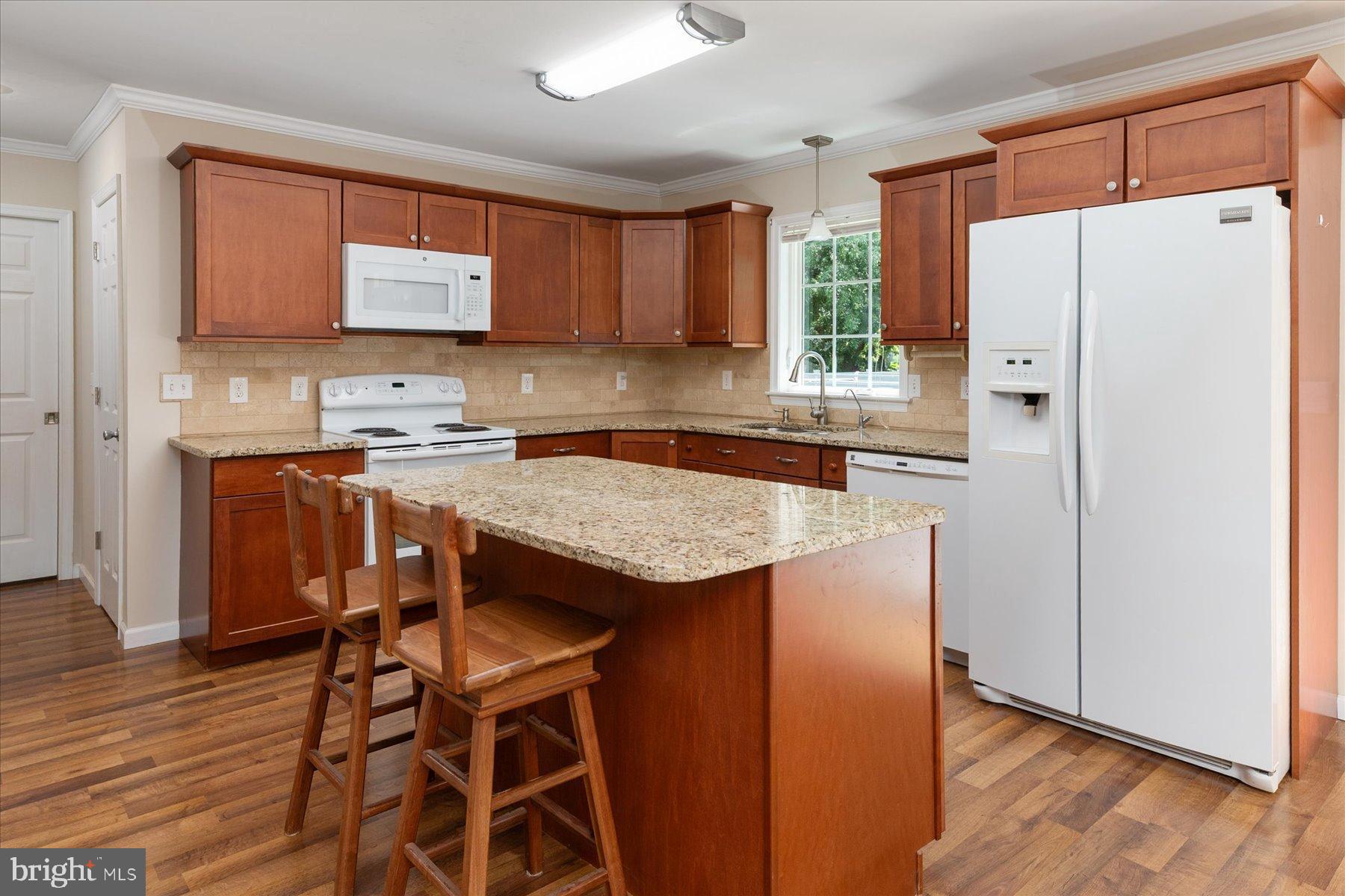 109 Calvert Road Stevensville, MD 21666 - Photo 27 of 41 Custom kitchen with warm wood accents.