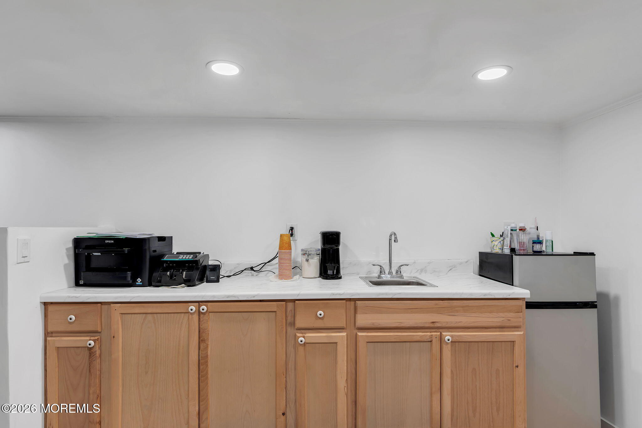 12 Main Street, Unit C Englishtown, NJ 07726 - Photo 10 of 14 a kitchen with stainless steel appliances a sink and cabinets