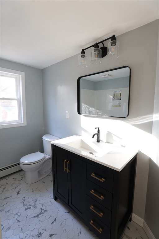 25 Center Hill Road Plymouth, MA 02360 - Photo 11 of 27 a bathroom with a toilet sink and mirror