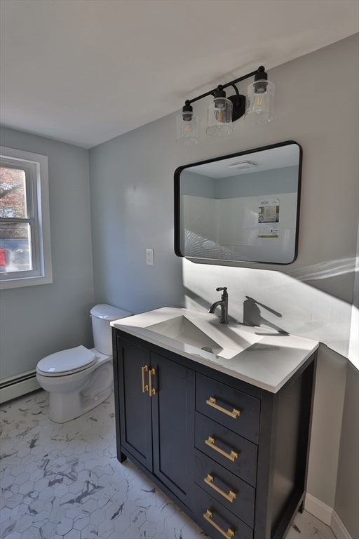 25 Center Hill Road Plymouth, MA 02360 - Photo 12 of 27 a bathroom with a granite countertop sink and a mirror