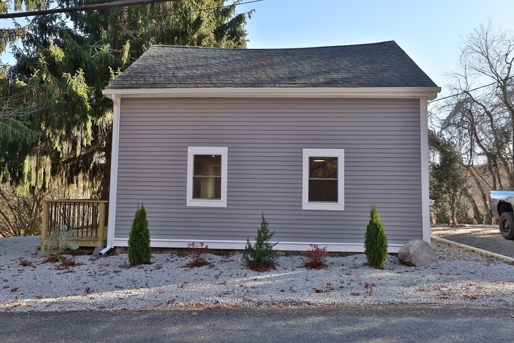 25 Center Hill Road Plymouth, MA 02360 - Photo 18 of 27 a view of a house with a yard and garage