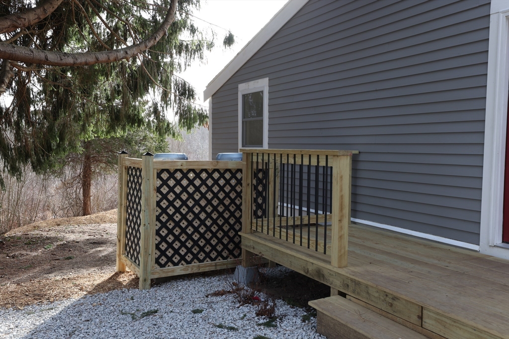 25 Center Hill Road Plymouth, MA 02360 - Photo 19 of 27 a side view of a house with a deck