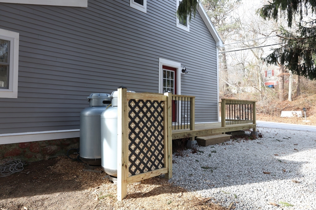 25 Center Hill Road Plymouth, MA 02360 - Photo 20 of 27 a view of a house with wooden fence