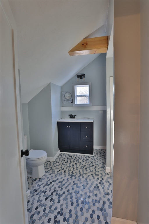 25 Center Hill Road Plymouth, MA 02360 - Photo 23 of 27 a bathroom with a granite countertop sink a mirror and a toilet