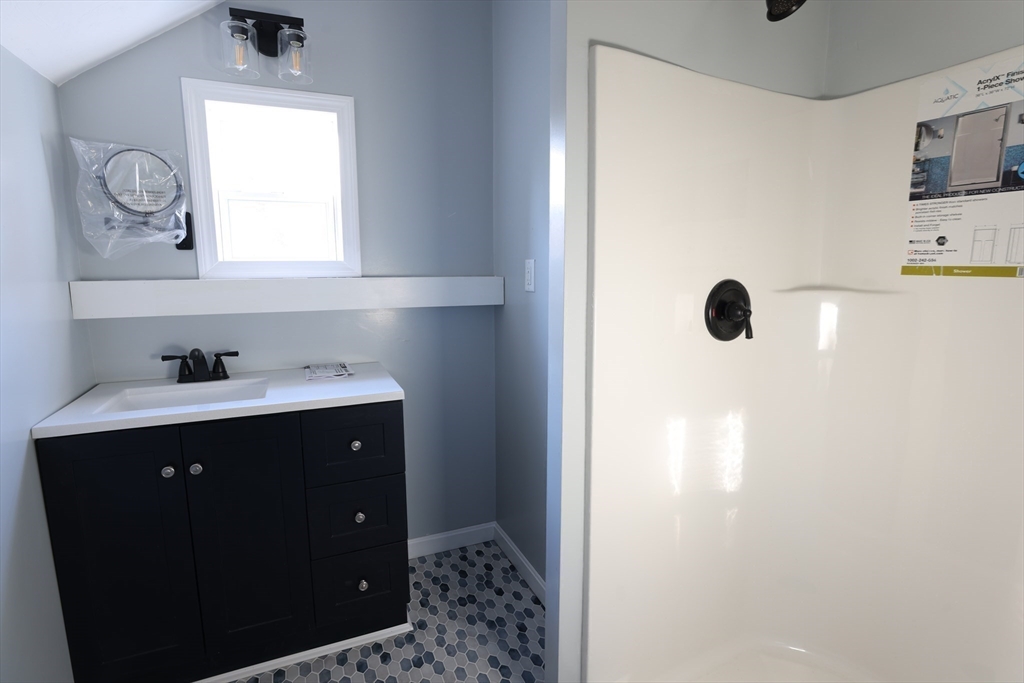 25 Center Hill Road Plymouth, MA 02360 - Photo 24 of 27 a bathroom with a sink vanity and mirror
