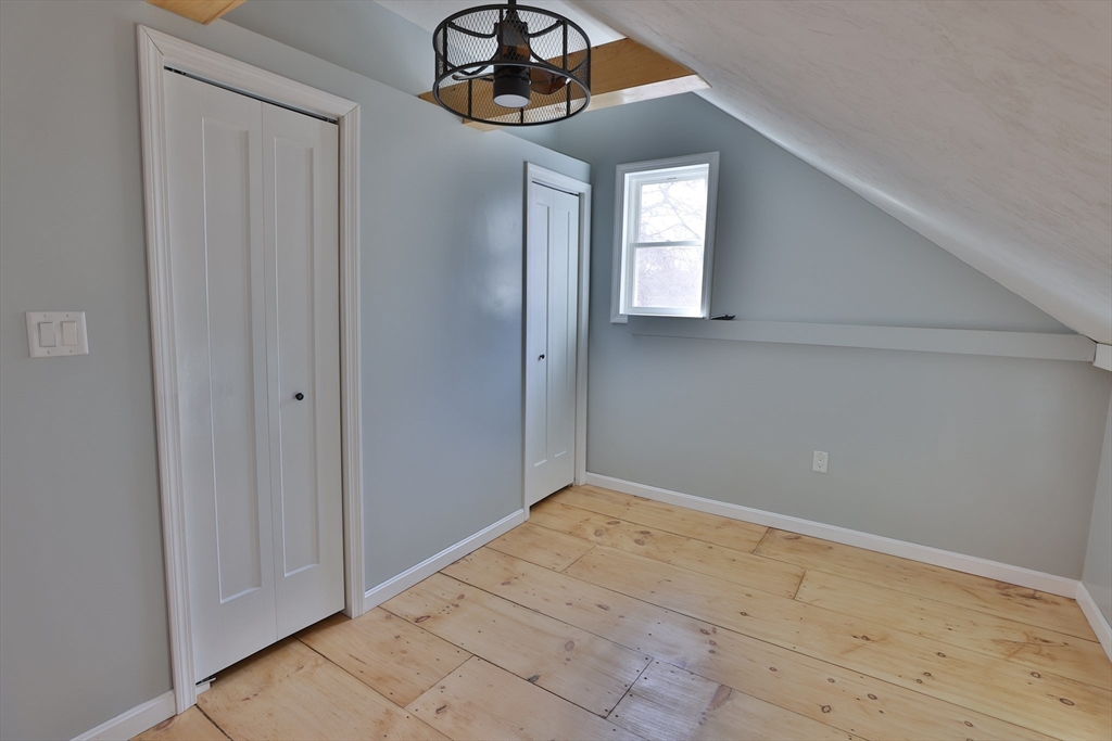 25 Center Hill Road Plymouth, MA 02360 - Photo 27 of 27 a view of a hallway with a chandelier fan
