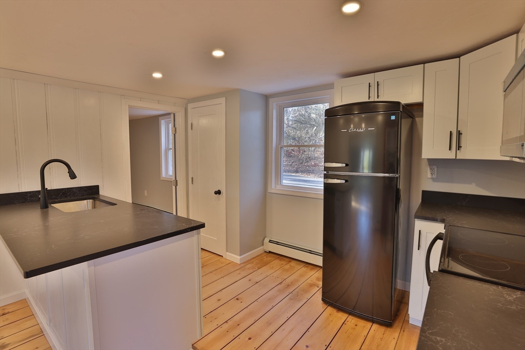 25 Center Hill Road Plymouth, MA 02360 - Photo 5 of 27 a kitchen with refrigerator and wooden floor