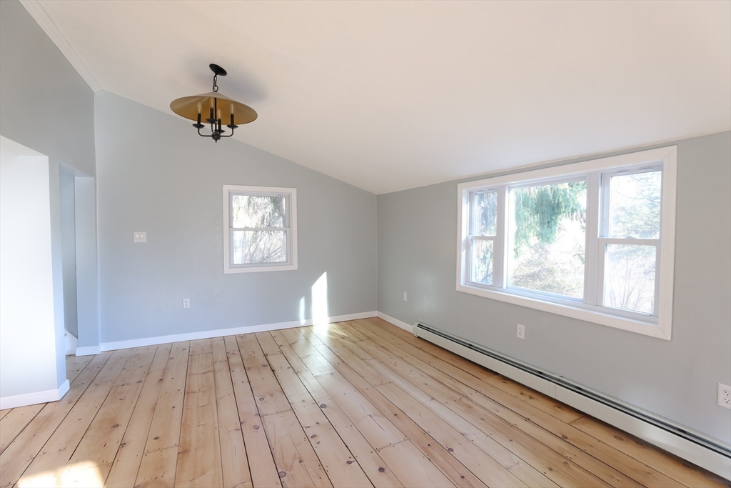 25 Center Hill Road Plymouth, MA 02360 - Photo 10 of 27 wooden floor in an empty room with a window