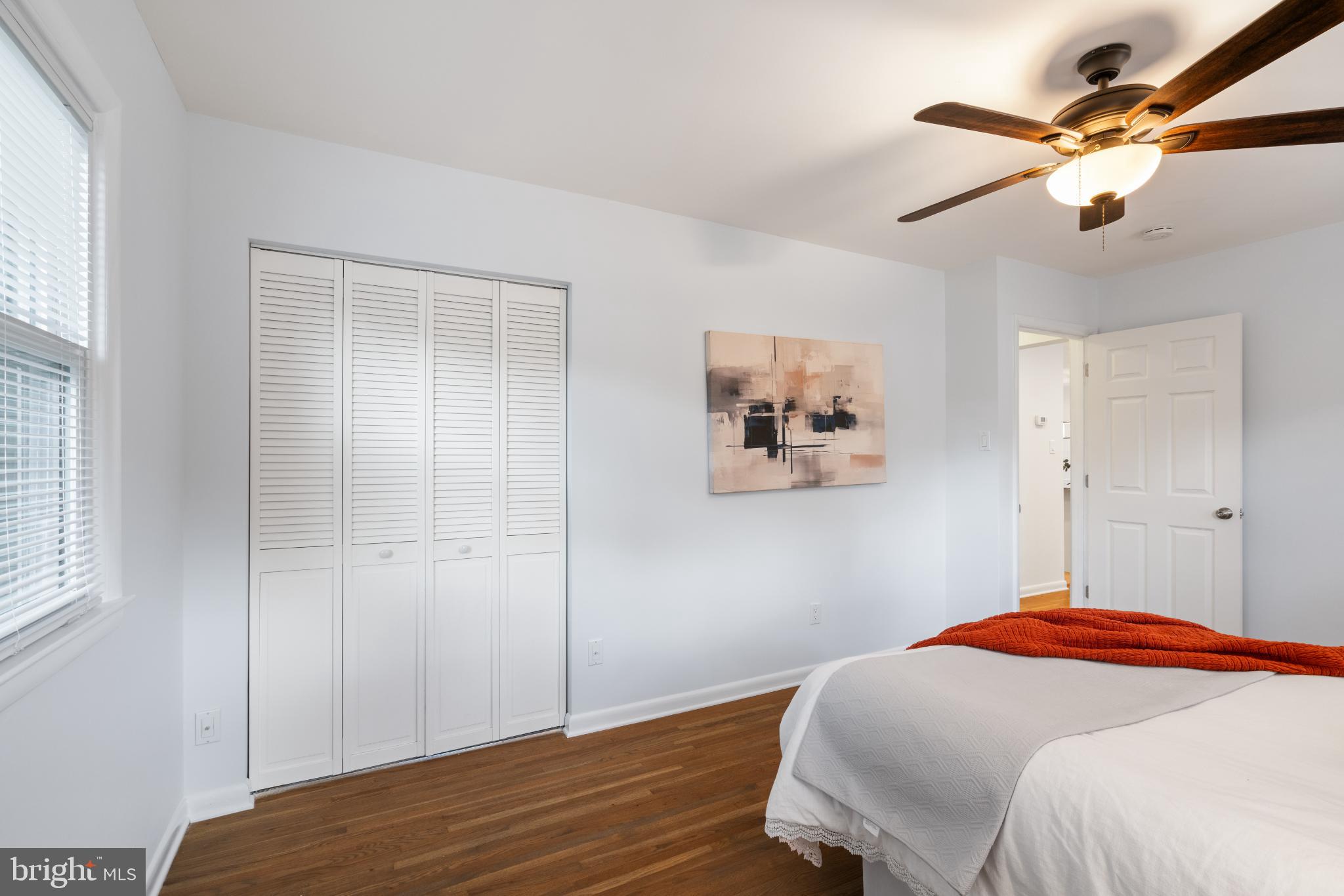 7105 Galgate Drive Springfield, VA 22152 - Photo 25 of 36 a bedroom with a bed and a chandelier