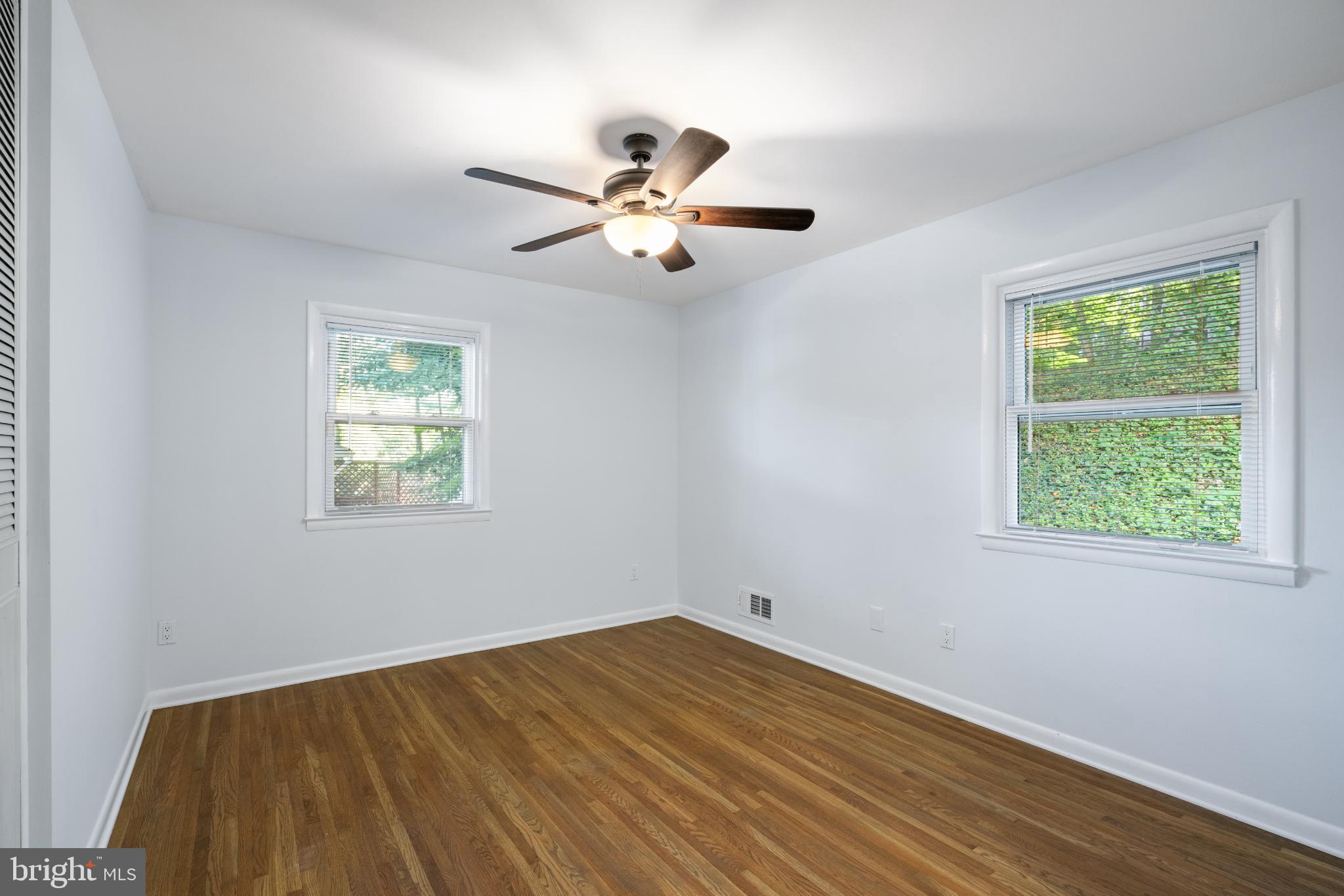 7105 Galgate Drive Springfield, VA 22152 - Photo 27 of 36 a view of empty room with wooden floor and fan