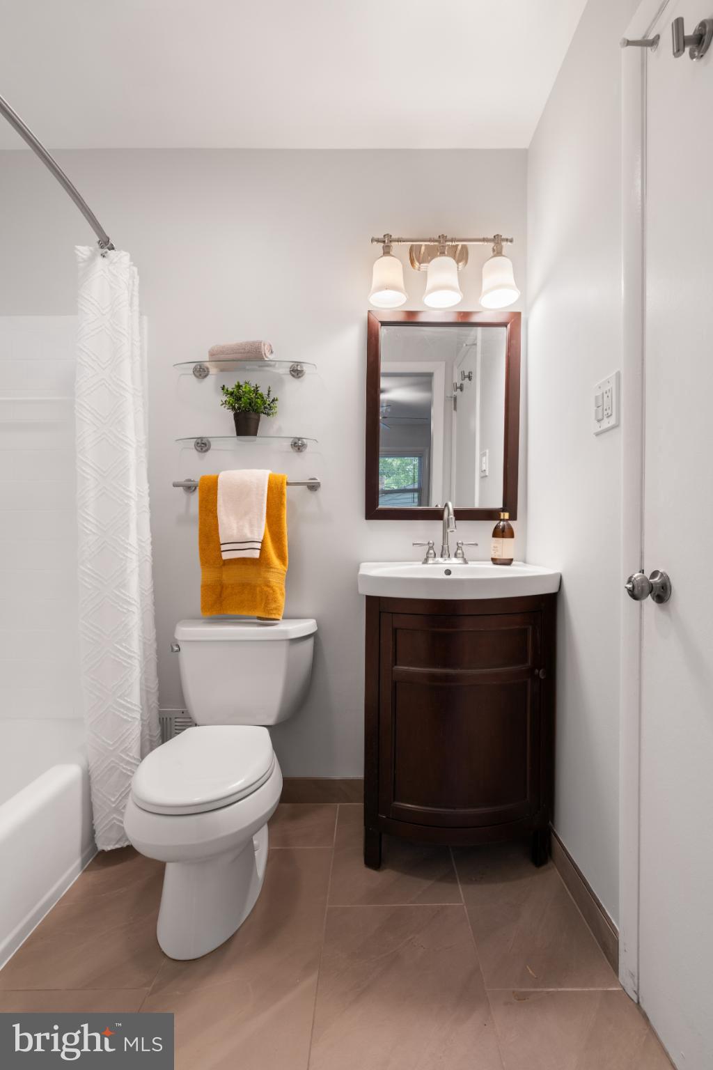 7105 Galgate Drive Springfield, VA 22152 - Photo 30 of 36 a bathroom with a sink a toilet and a mirror