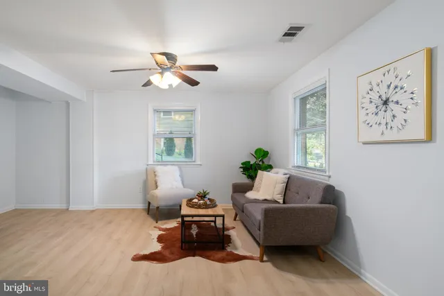 a living room with furniture and a window