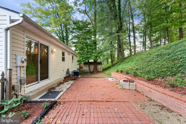 a view of a backyard with sitting area