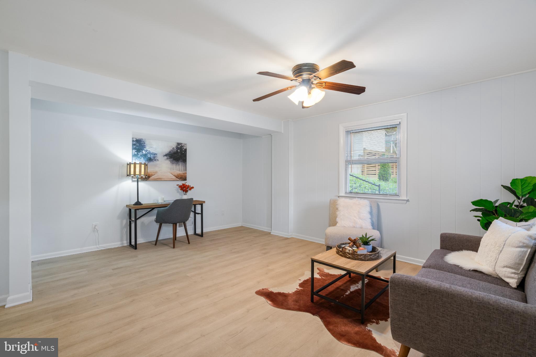 7105 Galgate Drive Springfield, VA 22152 - Photo 5 of 36 a living room with furniture and a window