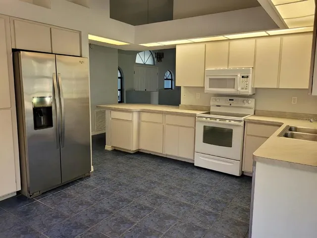 a view of a room with wooden floor lake and mountain view