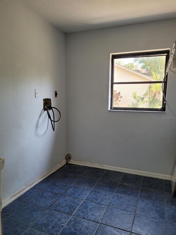 4314 Concert Street Port Charlotte, FL 33948 - Photo 14 of 27 a view of a room with rack and window