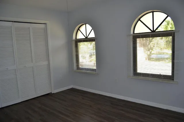 a view of a kitchen with a sink and a window