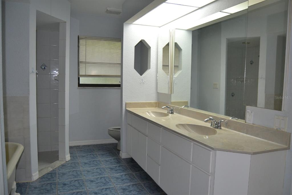 4314 Concert Street Port Charlotte, FL 33948 - Photo 19 of 27 a bathroom with a granite countertop sink and a mirror