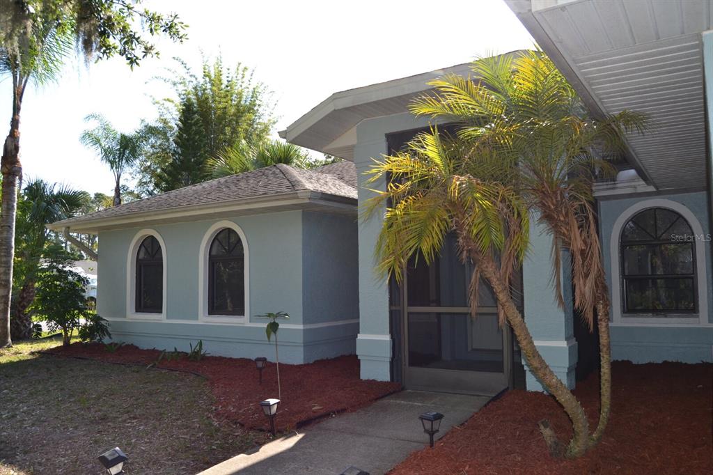 4314 Concert Street Port Charlotte, FL 33948 - Photo 2 of 27 a front view of a house with a garage