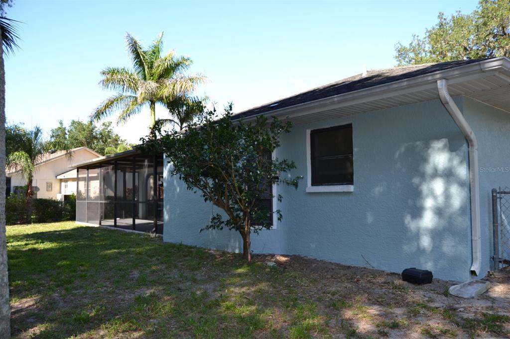 4314 Concert Street Port Charlotte, FL 33948 - Photo 25 of 27 a view of a house with a yard